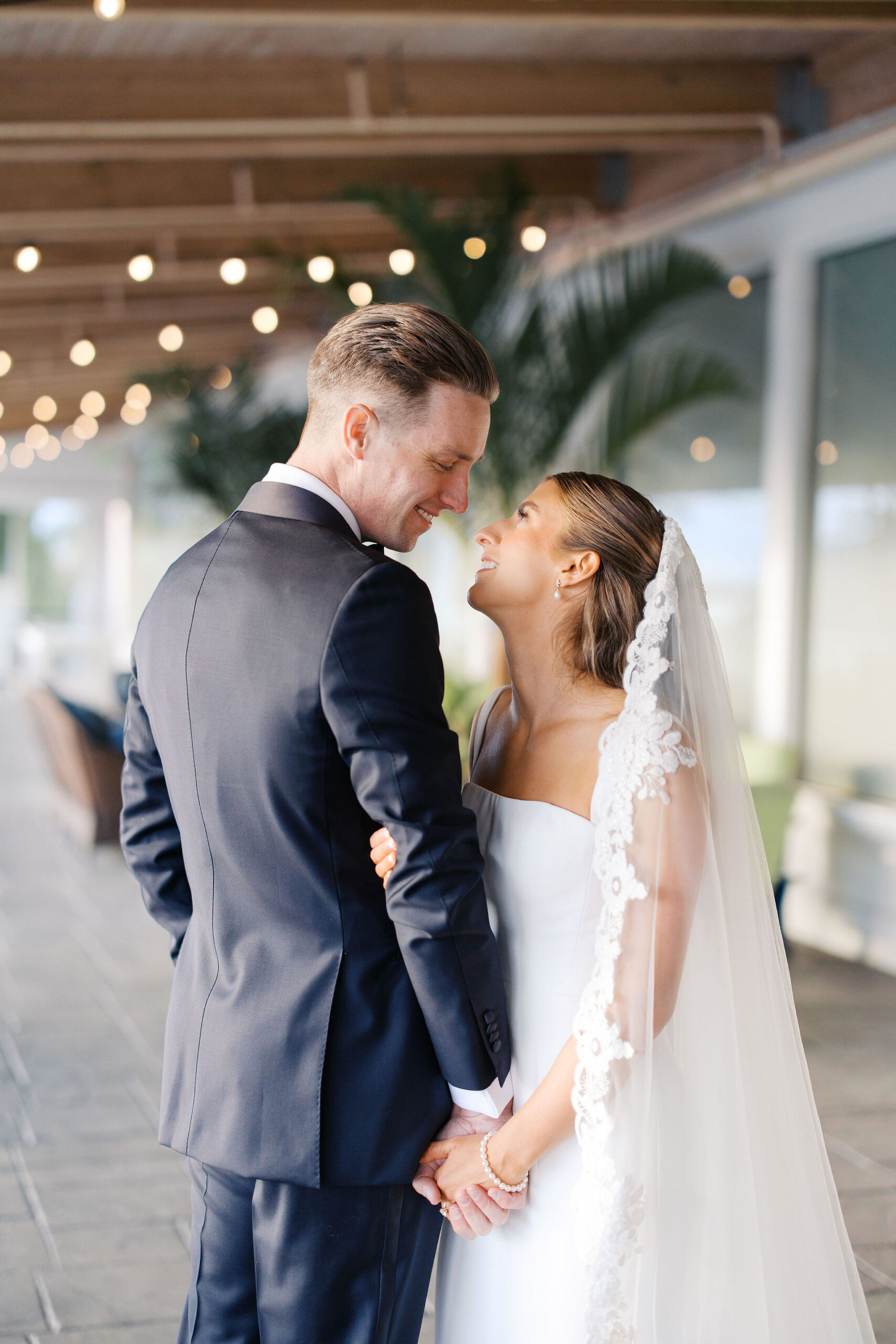 Bride and groom looking at one another at their Hotel LBI wedding with their Long Beach Island wedding photographer